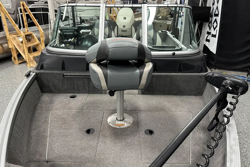 Slide: The Image of 2020 Alumacraft Classic 165 Sport boat interior with seating and equipment. - 9