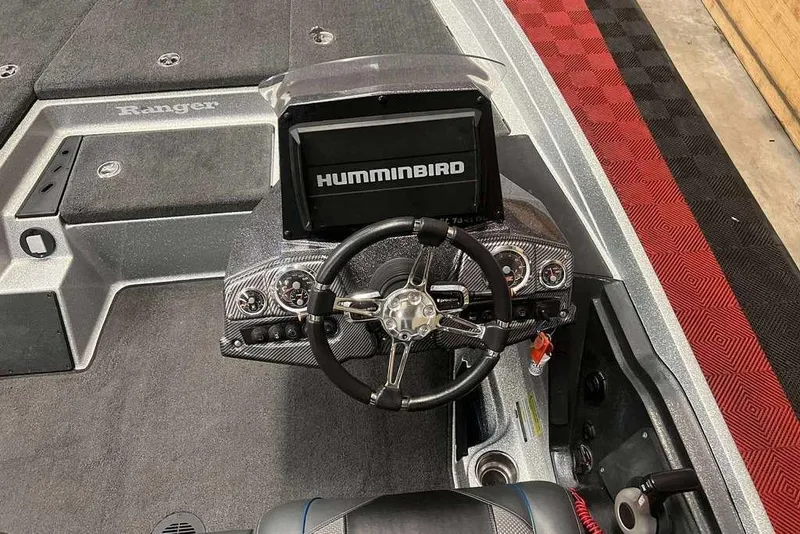 Slide: The Image of 2016 Ranger Z175 boat dashboard with Humminbird fishfinder and steering wheel. - 4