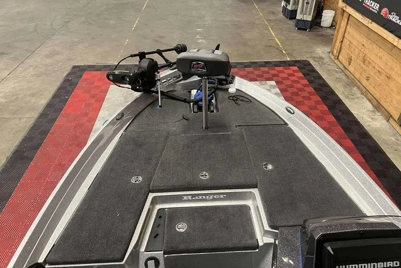 Slide: The Image of 2016 Ranger Z175 boat deck with trolling motor and fishing equipment. - 5