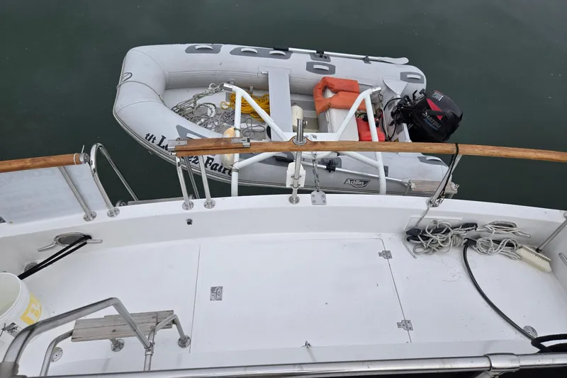 Slide: The Image of Ocean Alexander 423 Classicco 1993 yacht deck with dinghy and outboard motor. - 16