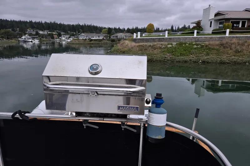 Slide: The Image of Outdoor grill on Ocean Alexander 423 Classicco yacht, 1993, near waterfront homes. - 19