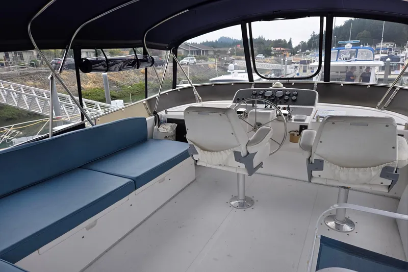 Slide: The Image of 1993 Ocean Alexander 423 Classicco yacht interior with helm, seating, and navigation equipment. - 26