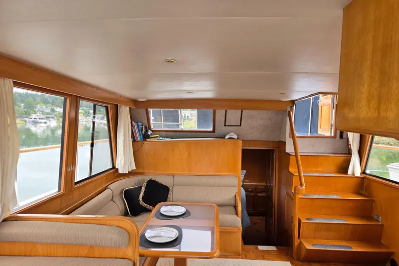 Slide: The Image of Interior of 1993 Ocean Alexander 423 Classicco yacht with wood finishes and cozy seating area. - 32