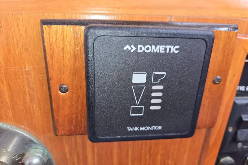 Slide: The Image of Dometic tank monitor on 1993 Ocean Alexander 423 Classicco yacht dashboard. - 42