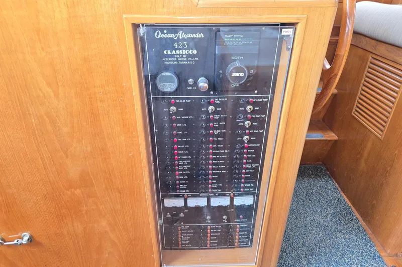 Slide: The Image of Control panel of 1993 Ocean Alexander 423 Classicco yacht, featuring various switches and indicators. - 43