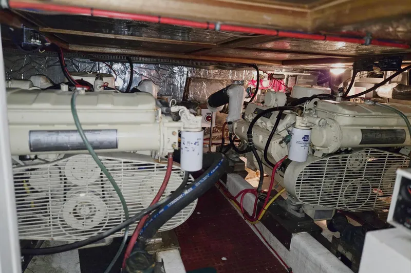 Slide: The Image of Engine room of 1993 Ocean Alexander 423 Classicco yacht, featuring dual engines and wiring. - 44