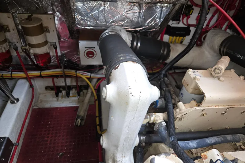 Slide: The Image of Engine room of a 1993 Ocean Alexander 423 Classicco yacht, showing mechanical components and wiring. - 52