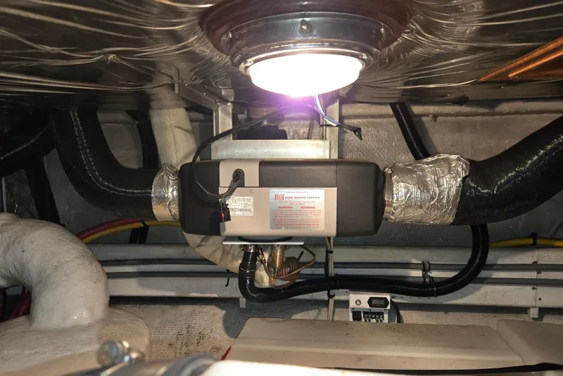 Slide: The Image of Engine room of 1993 Ocean Alexander 423 Classicco yacht with visible wiring and components. - 54