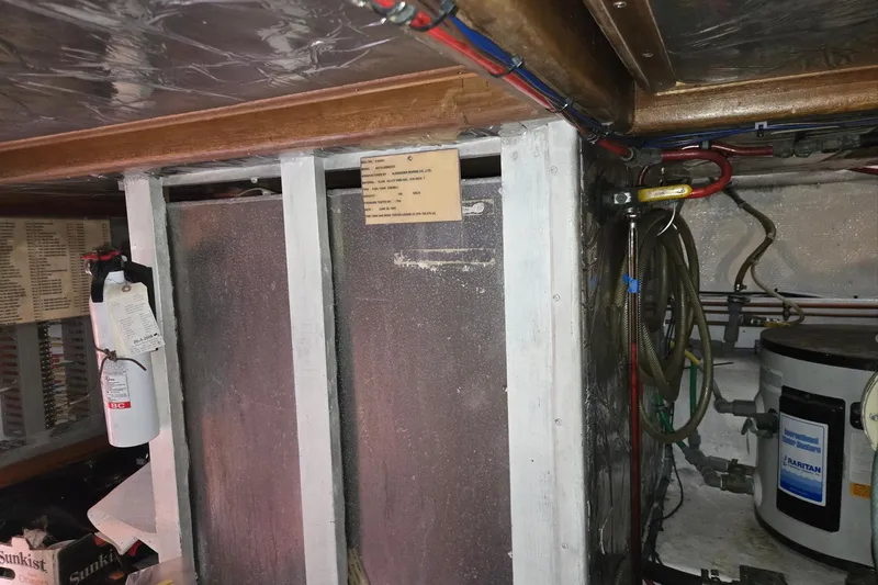 Slide: The Image of Engine room of 1993 Ocean Alexander 423 Classicco with fire extinguisher and wiring. - 57