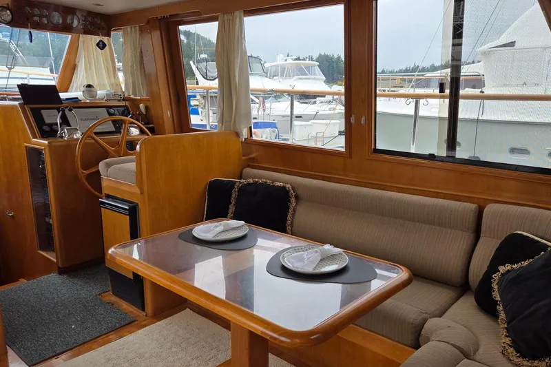 Slide: The Image of Interior of 1993 Ocean Alexander 423 Classicco yacht with cozy seating and helm. - 58