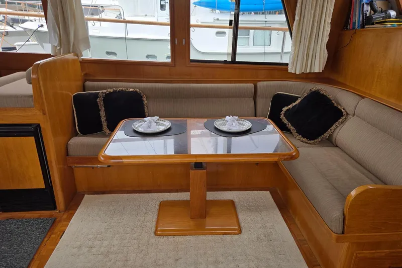 Slide: The Image of Interior of 1993 Ocean Alexander 423 Classicco yacht with cozy seating and elegant table setting. - 60