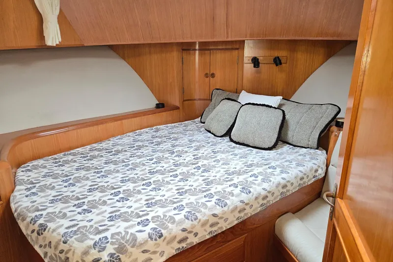 Slide: The Image of Cozy cabin interior of 1993 Ocean Alexander 423 Classicco yacht with bed and cushions. - 69