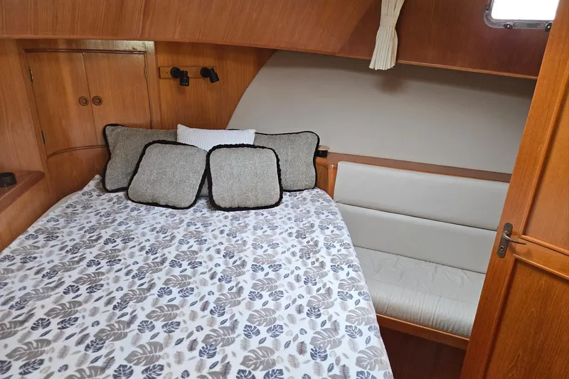 Slide: The Image of Cozy cabin interior of 1993 Ocean Alexander 423 Classicco yacht with bed and cushions. - 70