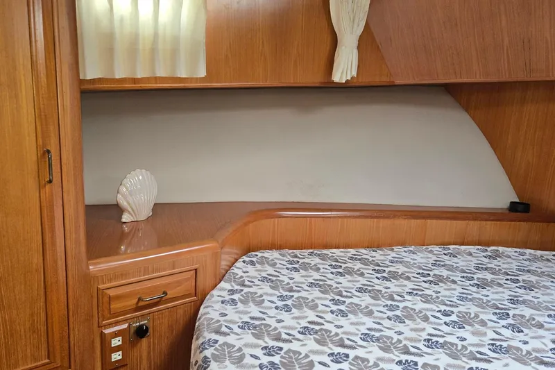 Slide: The Image of Cozy cabin interior of 1993 Ocean Alexander 423 Classicco yacht with wooden finish. - 71