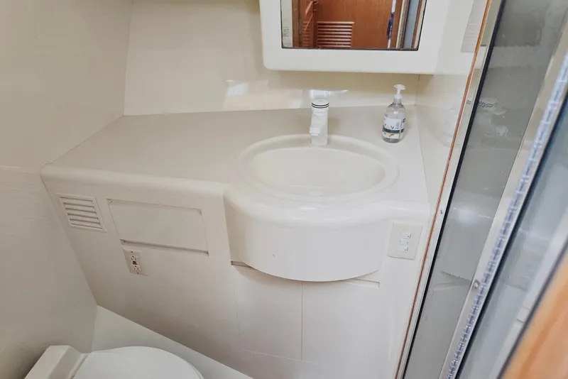 Slide: The Image of Bathroom interior of 1993 Ocean Alexander 423 Classicco yacht, featuring sink and mirror. - 73