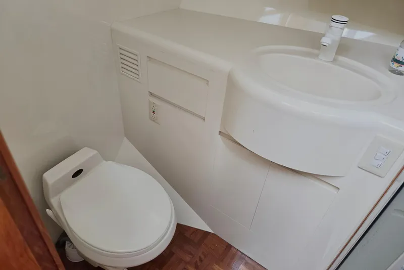 Slide: The Image of Bathroom interior of 1993 Ocean Alexander 423 Classicco yacht, featuring toilet and sink. - 74