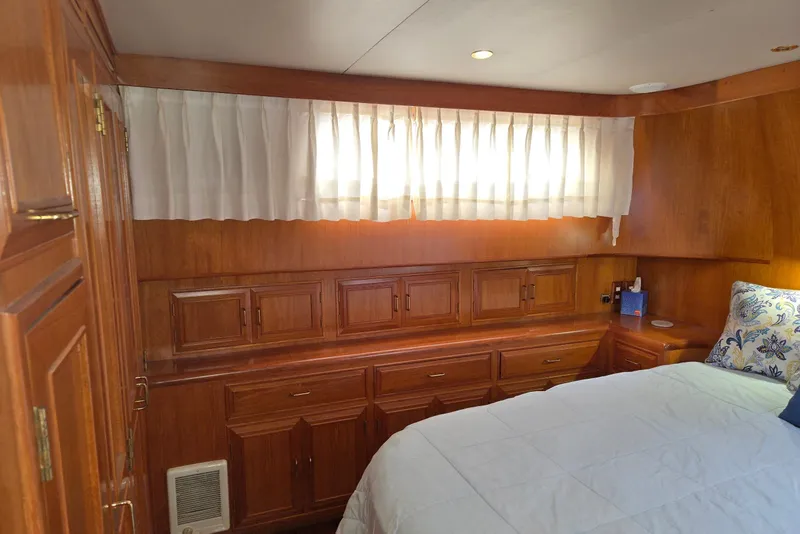 Slide: The Image of Cozy cabin interior of 1993 Ocean Alexander 423 Classicco with wooden cabinetry and bed. - 81