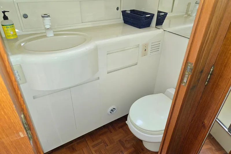 Slide: The Image of Bathroom interior of 1993 Ocean Alexander 423 Classicco yacht, featuring sink and toilet. - 85