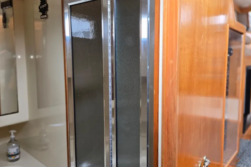 Slide: The Image of Interior view of 1993 Ocean Alexander 423 Classicco yacht, featuring wood cabinetry and modern fixtures. - 86