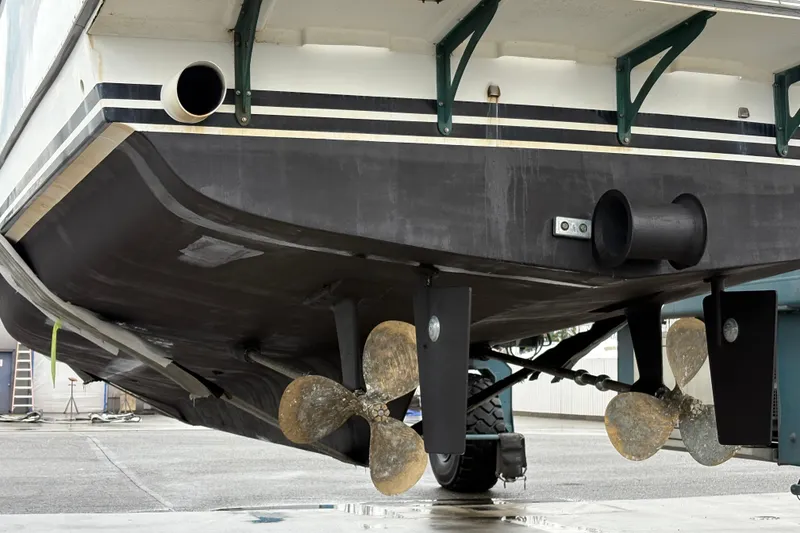 Slide: The Image of 1993 Ocean Alexander 423 Classico yacht hull and propellers in dry dock. - 11