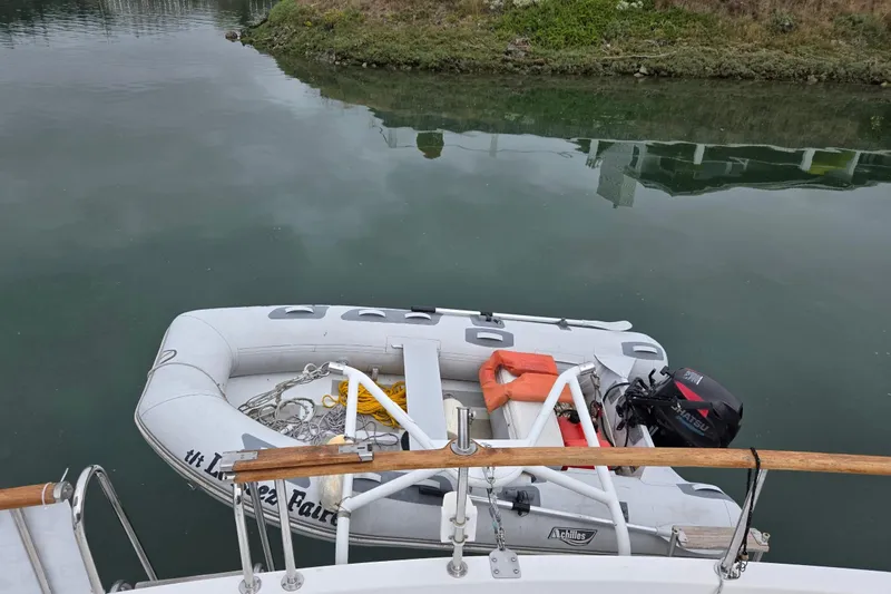 Slide: The Image of Inflatable dinghy with motor, docked beside 1993 Ocean Alexander 423 Classicco yacht. - 17