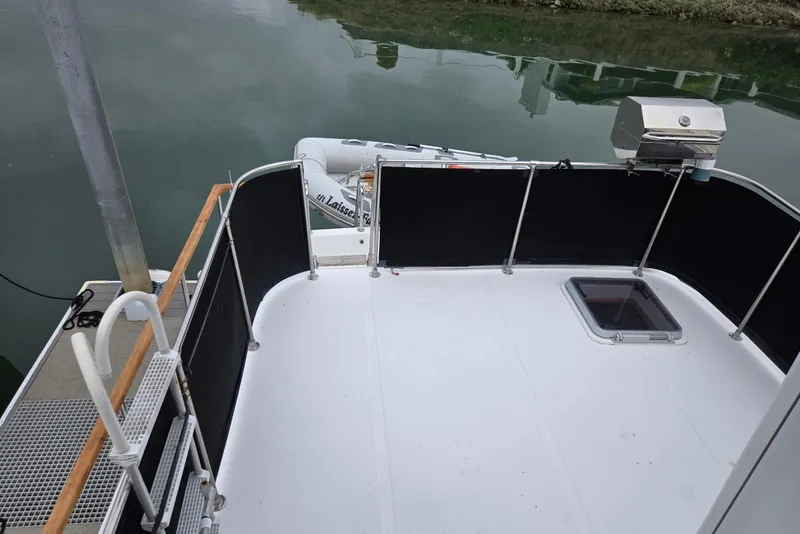 Slide: The Image of 1993 Ocean Alexander 423 Classicco yacht deck with railing and hatch. - 25