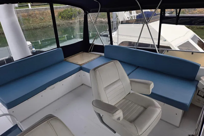 Slide: The Image of Interior of 1993 Ocean Alexander 423 Classicco yacht with blue seating and helm chair. - 28