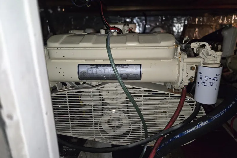 Slide: The Image of Engine compartment of a 1993 Ocean Alexander 423 Classicco yacht, featuring mechanical components. - 49