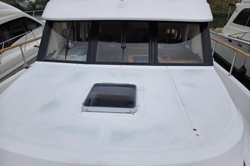 Slide: The Image of 1993 Ocean Alexander 423 Classicco yacht deck with hatch and windows. - 6