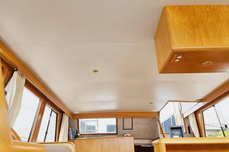 Slide: The Image of Interior of 1993 Ocean Alexander 423 Classicco yacht with wooden accents and large windows. - 61