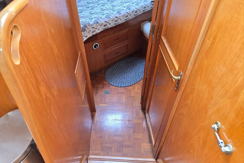 Slide: The Image of Interior of 1993 Ocean Alexander 423 Classicco yacht with wooden doors and cozy cabin. - 68