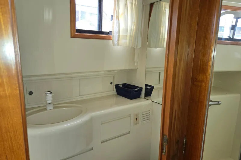 Slide: The Image of Bathroom interior of 1993 Ocean Alexander 423 Classicco yacht, featuring sink and mirror. - 84