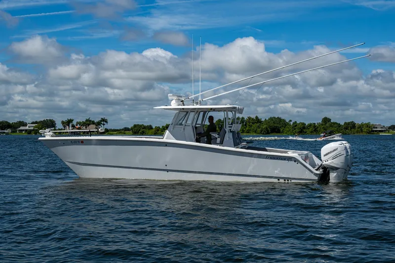 Slide: The Image of 2022 Freeman 34VH boat on a lake under a cloudy sky. - 11