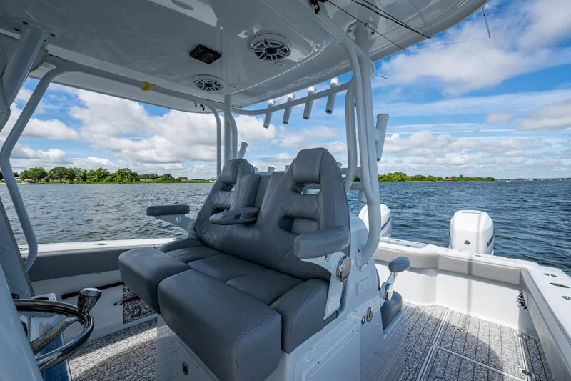 Slide: The Image of 2022 Freeman 34VH boat interior with luxurious seating on a sunny day. - 18