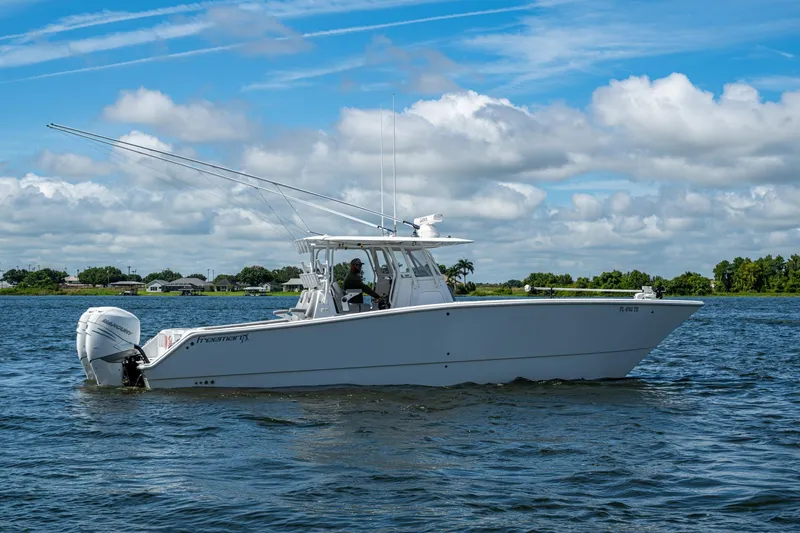 Slide: The Image of 2022 Freeman 34VH boat cruising on a sunny day with clear skies. - 20