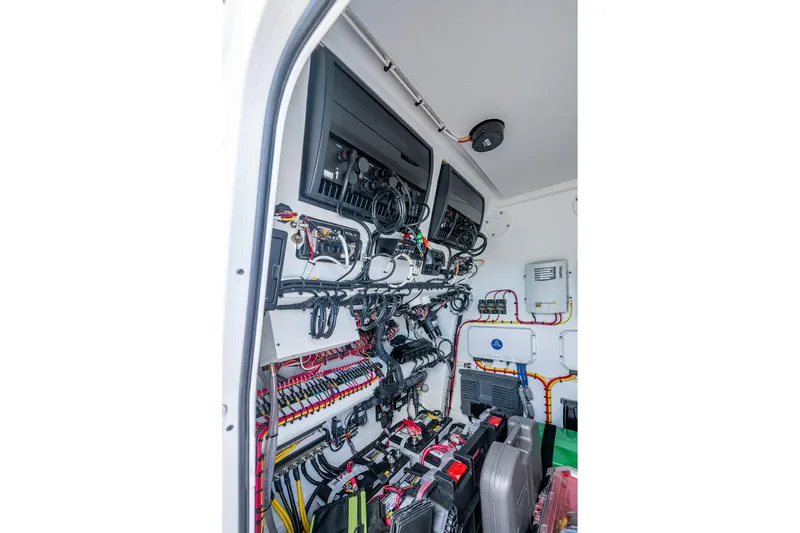 Slide: The Image of Electrical system inside a 2022 Freeman 34VH boat, showcasing organized wiring and components. - 22