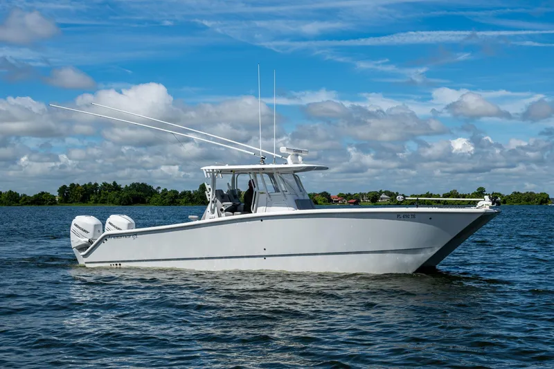 Slide: The Image of 2022 Freeman 34VH boat cruising on a sunny day with blue skies and clouds. - 28