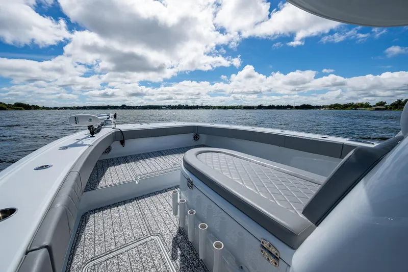 Slide: The Image of 2022 Freeman 34VH boat interior with seating, on a sunny day at sea. - 30