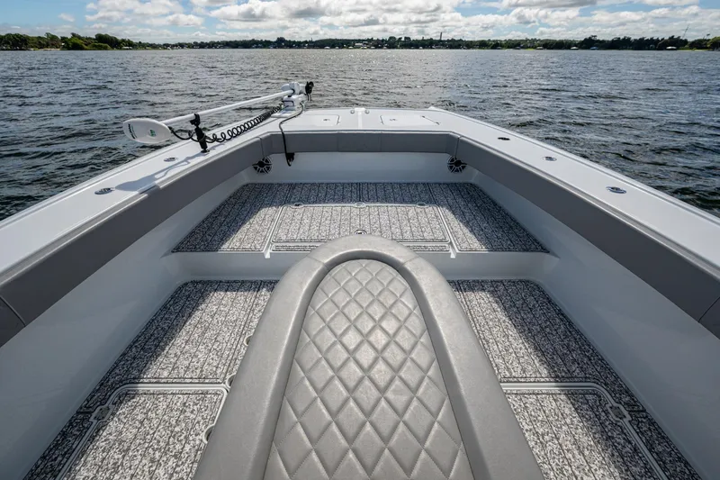 Slide: The Image of Bow view of 2022 Freeman 34VH boat with textured flooring on open water. - 32