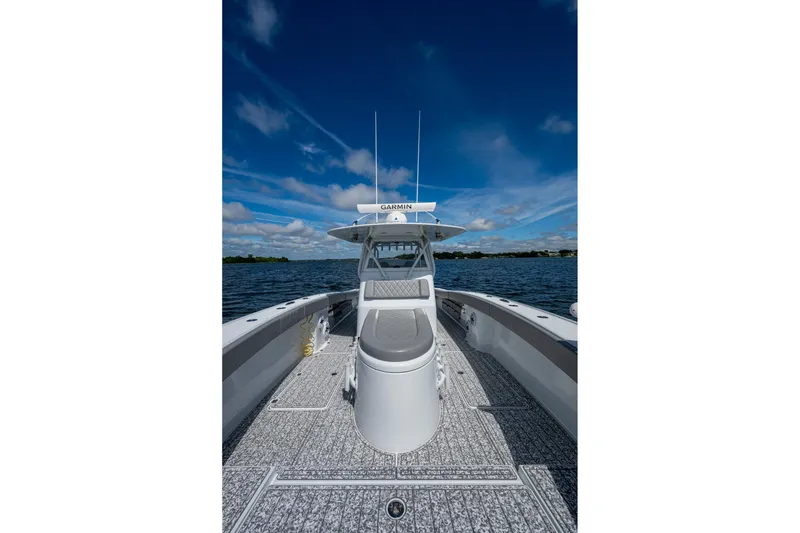 Slide: The Image of Freeman 34VH 2022 boat on water under clear blue sky. - 38