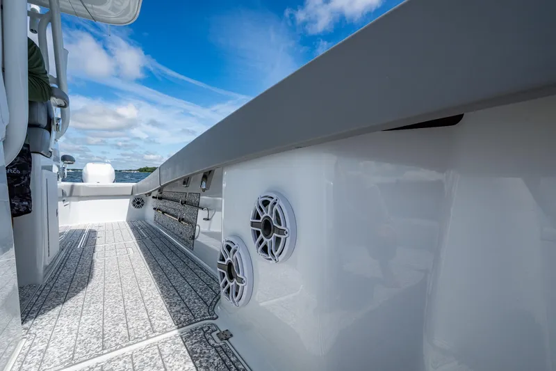 Slide: The Image of 2022 Freeman 34VH boat interior with speakers, sleek design, and ocean view. - 42