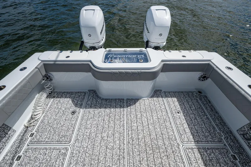 Slide: The Image of Freeman 34VH 2022 boat deck with twin engines on water. - 43
