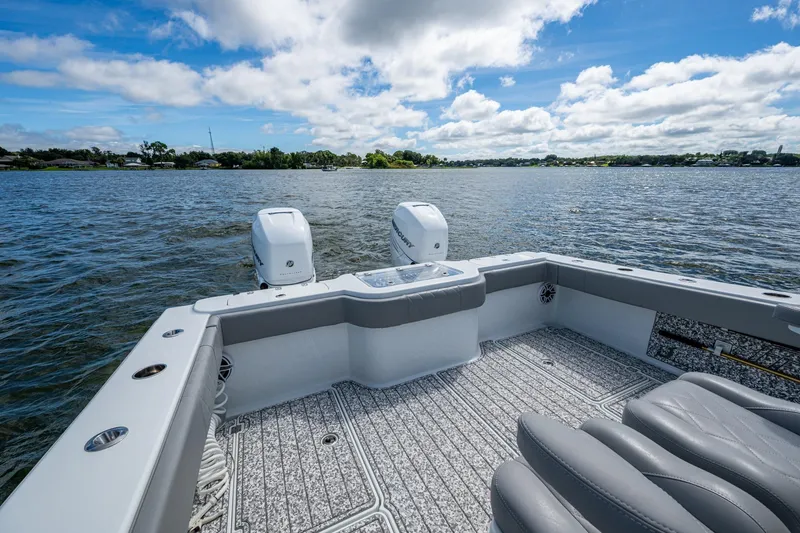 Slide: The Image of Freeman 34VH 2022 boat on water, featuring dual engines and spacious deck. - 44