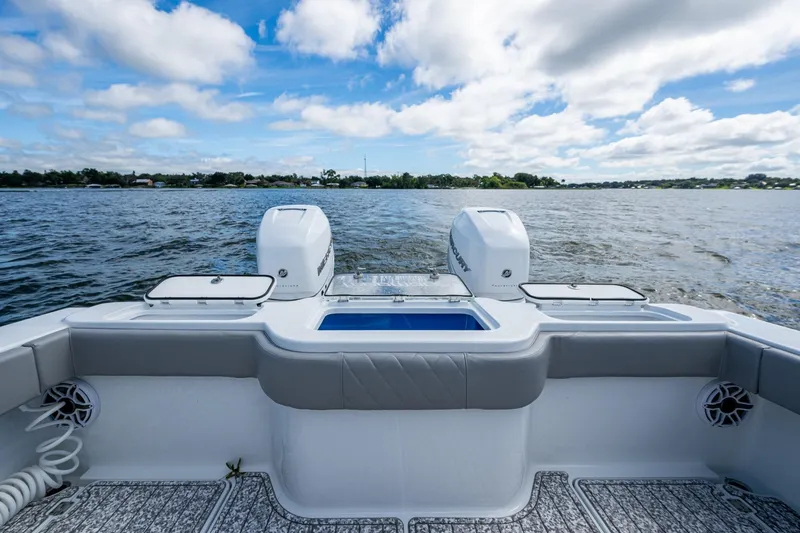 Slide: The Image of Freeman 34VH 2022 boat on water, featuring dual engines and spacious deck. - 46