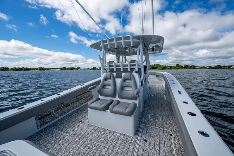 Slide: The Image of 2022 Freeman 34VH boat on water, featuring sleek design and comfortable seating. - 48