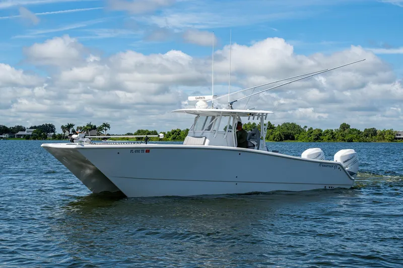 Slide: The Image of 2022 Freeman 34VH boat cruising on a sunny day with clear skies. - 5