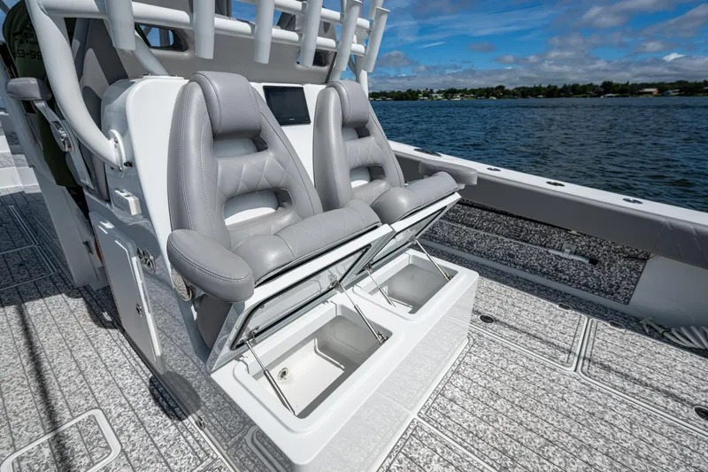 Slide: The Image of 2022 Freeman 34VH boat with open storage compartments and luxurious seating on deck. - 53