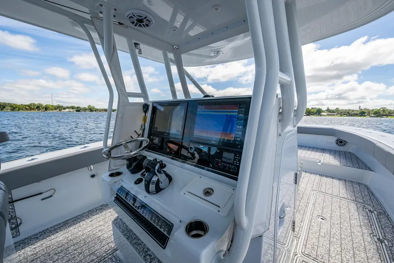 Slide: The Image of Interior view of 2022 Freeman 34VH boat cockpit with advanced navigation system. - 59