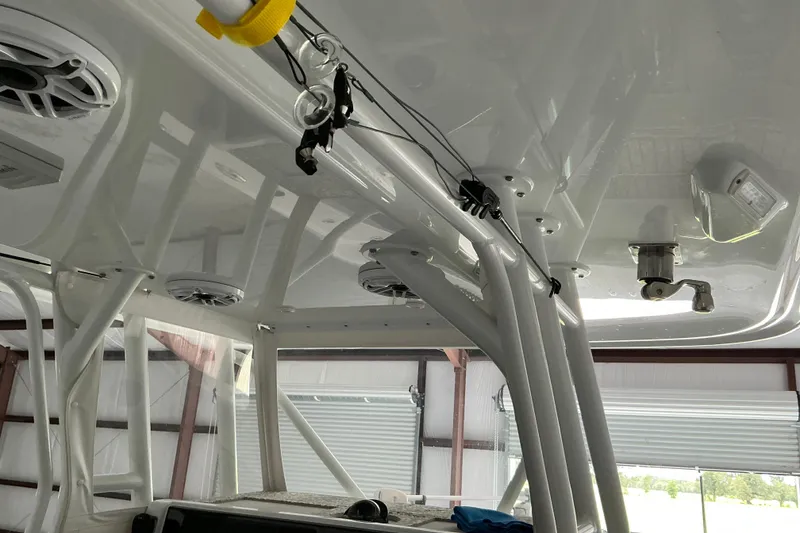 Slide: The Image of Interior view of a 2022 Freeman 34VH boat, showcasing speakers and structural details. - 63