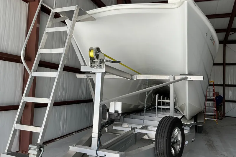 Slide: The Image of Freeman 34VH 2022 boat on trailer in storage facility with ladder access. - 66
